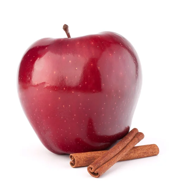 Red apple and cinnamon sticks — Stock Photo, Image