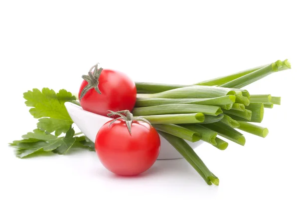 Spring onions and cherry tomato in bowl — Stock Photo, Image