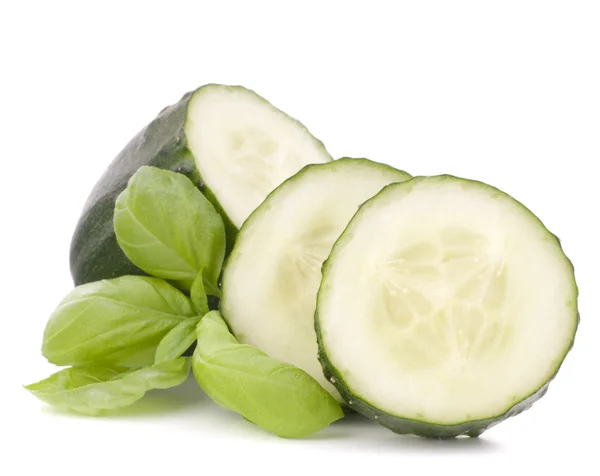 Sliced cucumber vegetable and basil leaves still life — Stock Photo, Image