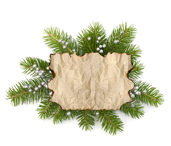 Old parchment paper with copy space on Christmas tree branch bac — Stock Photo, Image