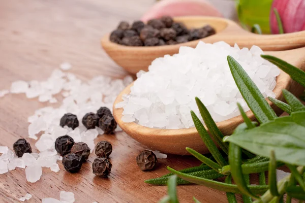 Fresh herbs and salt spoon — Stock Photo, Image