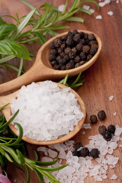 Fresh herbs and salt spoon — Stock Photo, Image