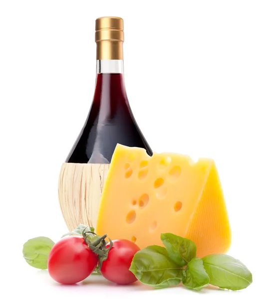 Red wine bottle, cheese and tomato still life — Stock Photo, Image