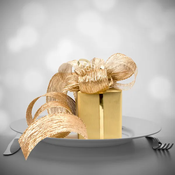 Luxurious gift on plate. — Stock Photo, Image