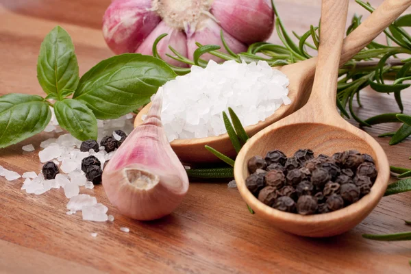 Fresh herbs and salt spoon Stock Photo