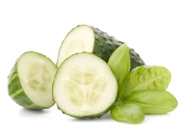 Sliced cucumber vegetable and basil leaves still life — Stock Photo, Image