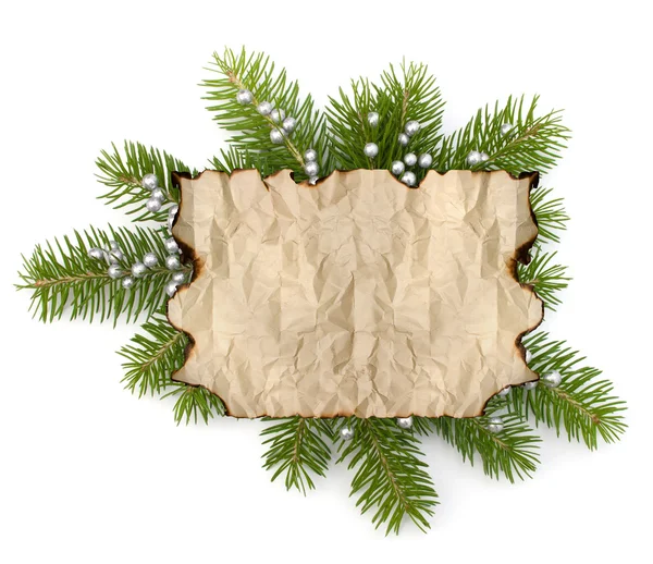 Old parchment paper with copy space on Christmas tree branch bac — Stock Photo, Image