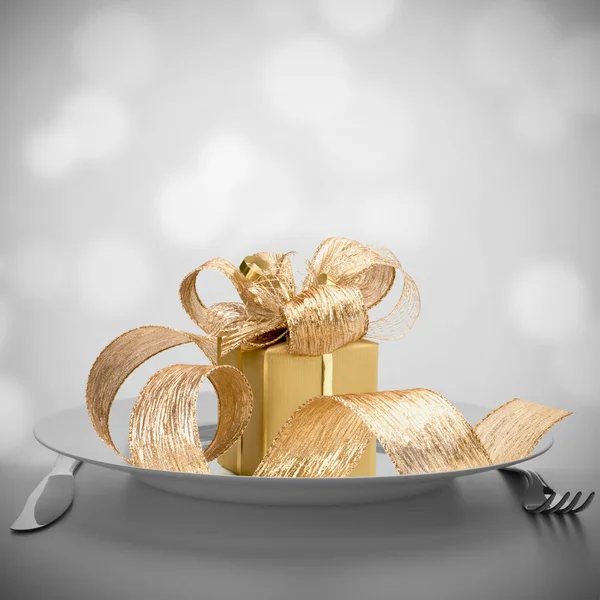 Luxurious gift on plate. — Stock Photo, Image