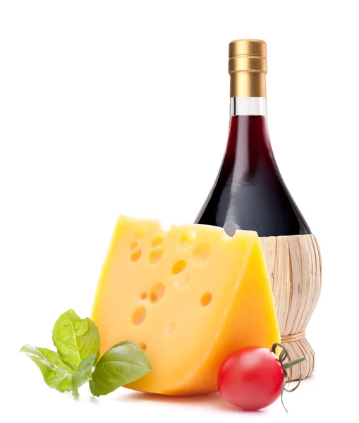 Red wine bottle, cheese and tomato still life — Stock Photo, Image