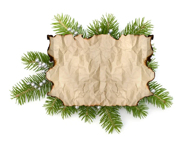 Old parchment paper with copy space on Christmas tree branch bac — Stock Photo, Image