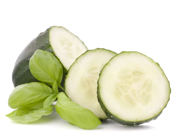 Sliced cucumber vegetable and basil leaves still life — Stock Photo, Image