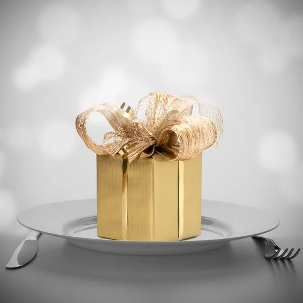 Luxurious gift on plate. — Stock Photo, Image