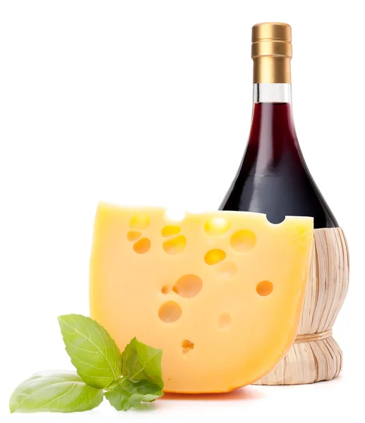 Red wine bottle and cheese still life — Stock Photo, Image