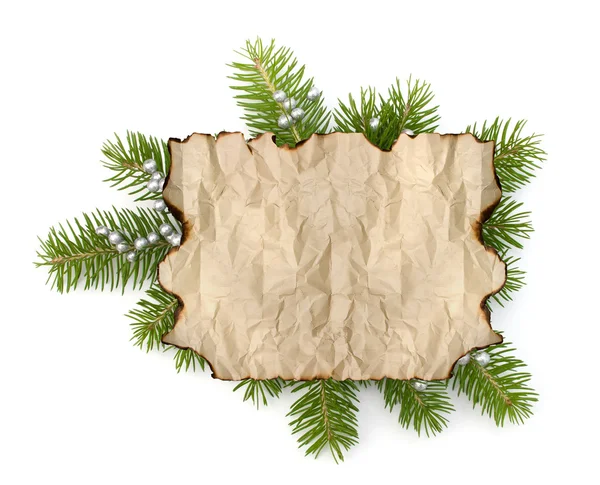 Old parchment paper with copy space on Christmas tree branch bac — Stock Photo, Image