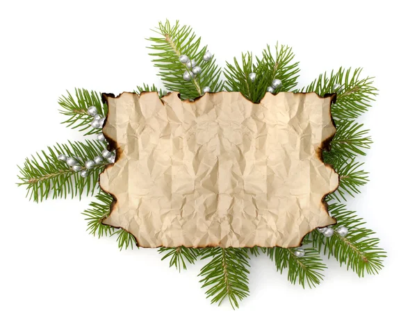 Old parchment paper with copy space on Christmas tree branch bac — Stock Photo, Image