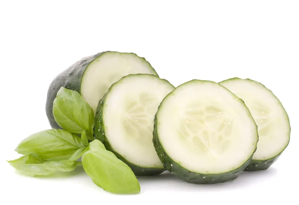 Sliced cucumber vegetable and basil leaves still life — Stock Photo, Image