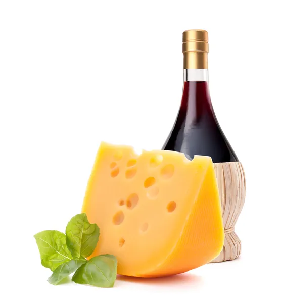 Red wine bottle and cheese still life — Stock Photo, Image