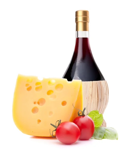 Red wine bottle, cheese and tomato still life — Stock Photo, Image