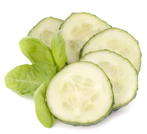 Sliced cucumber vegetable and basil leaves still life — Stock Photo, Image