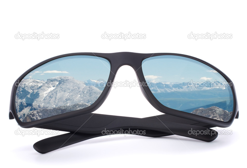 Black sunglasses with mountain reflection on isolated white back