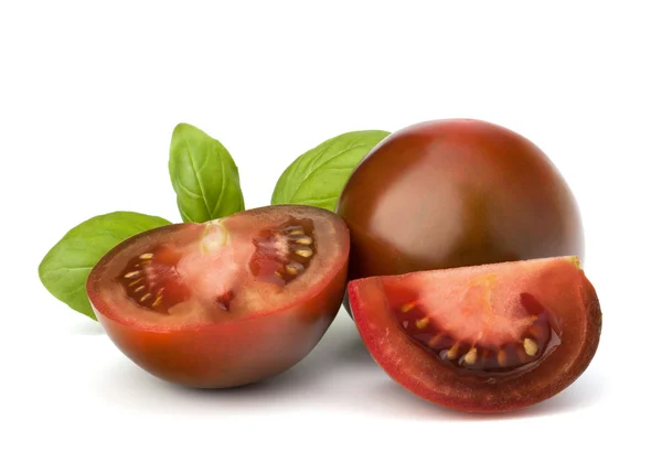 トマトの kumato とバジルの葉 — ストック写真