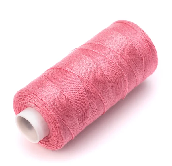 Рожева голка з нитки — стокове фото
