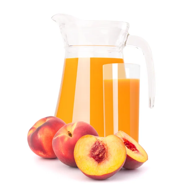 Peach fruit juice in glass jug — Stock Photo, Image