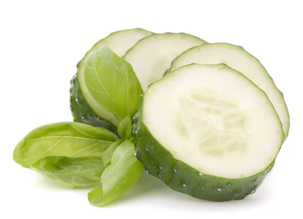 Sliced cucumber vegetable and basil leaves still life — Stock Photo, Image