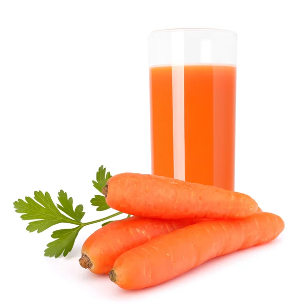 Carrot juice glass and carrot tubers — Stock Photo, Image