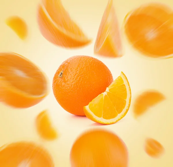 Flying sliced orange fruit segments — Stock Photo, Image