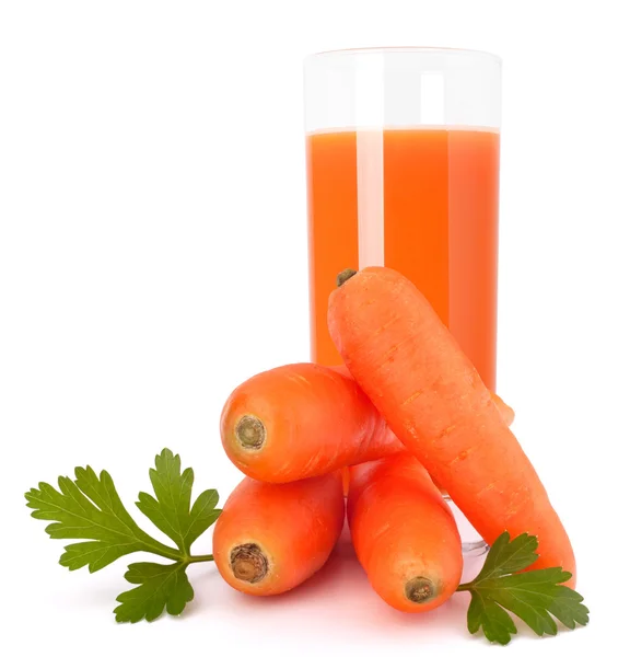 Carrot juice glass and carrot tubers — Stock Photo, Image
