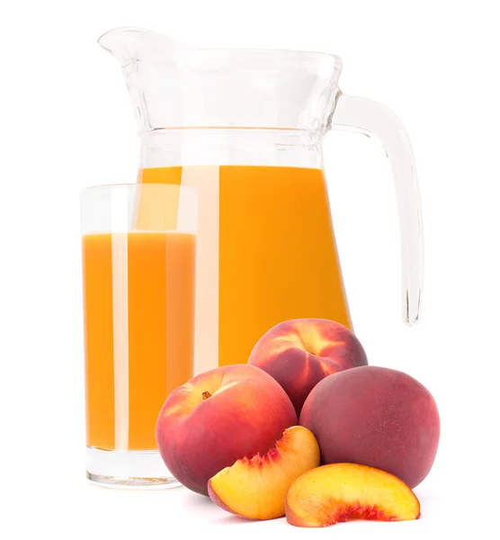 Peach fruit juice in glass jug — Stock Photo, Image
