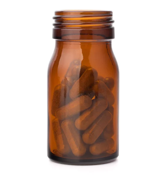 Cápsulas de medicamentos à base de plantas em frasco de vidro marrom. Medicina alternativa — Fotografia de Stock
