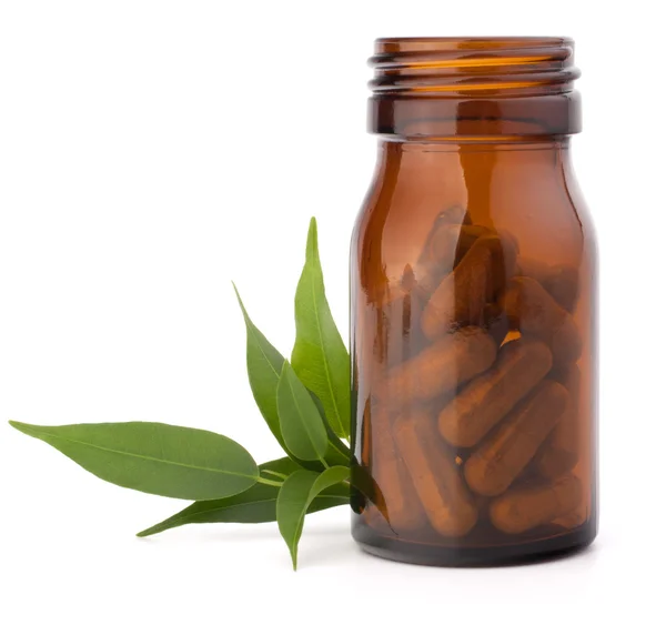 Herbal drug capsules in brown glass bottle. Alternative medicine — Stock Photo, Image