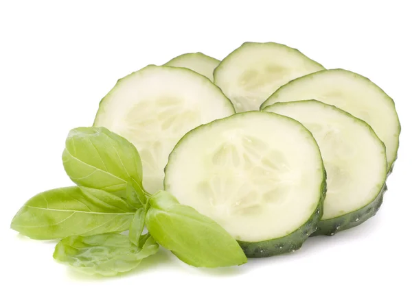 Sliced cucumber vegetable and basil leaves still life — Stock Photo, Image