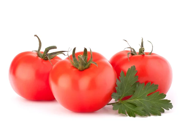 Drei Tomatengemüse und Petersilienblätter Stillleben — Stockfoto