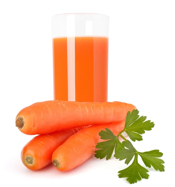 Carrot juice glass and carrot tubers — Stock Photo, Image