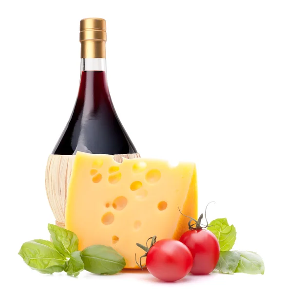 Red wine bottle, cheese and tomato still life — Stock Photo, Image