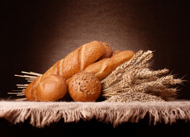 Assortment of breads and ears bunch still life clipart