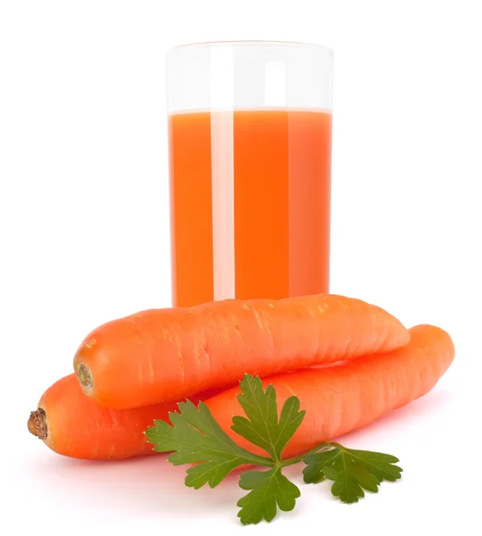 Carrot juice glass and carrot tubers — Stock Photo, Image