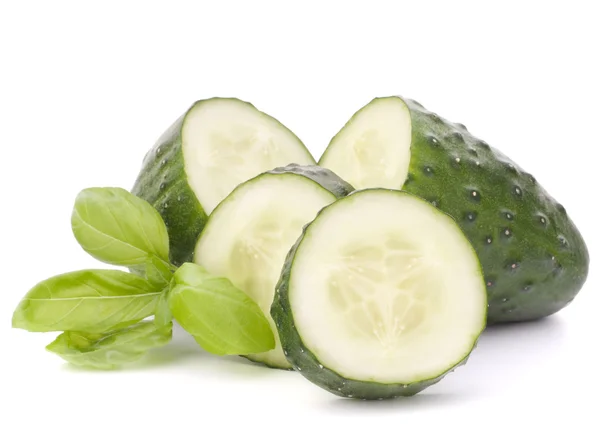 Sliced cucumber vegetable and basil leaves still life — Stock Photo, Image