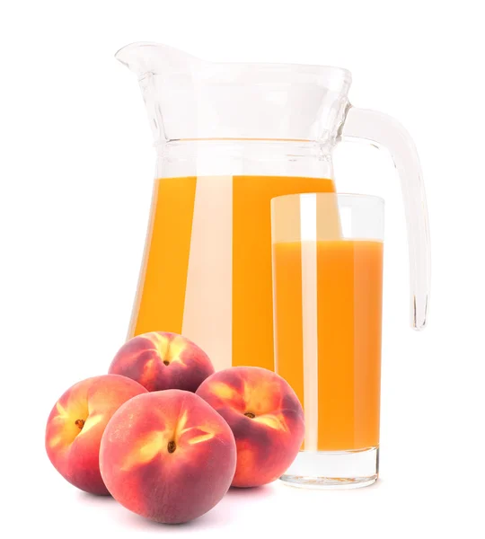 Peach fruit juice in glass jug — Stock Photo, Image