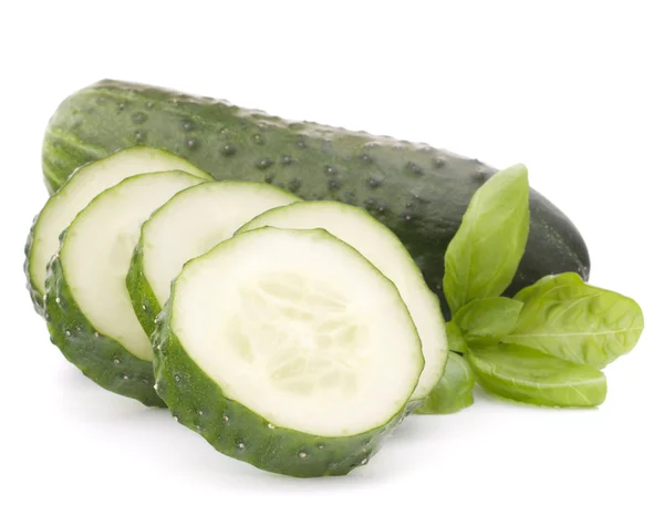 Sliced cucumber vegetable and basil leaves still life — Stock Photo, Image