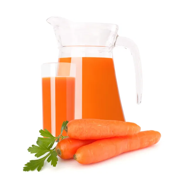 Carrot vegetable juice in glass jug — Stock Photo, Image