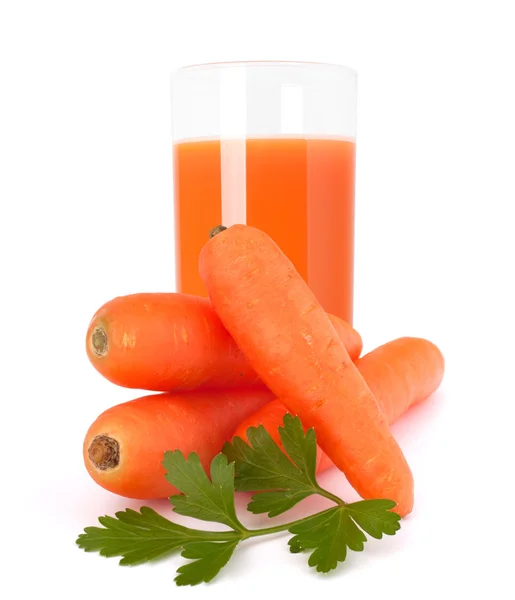 Carrot juice glass and carrot tubers — Stock Photo, Image