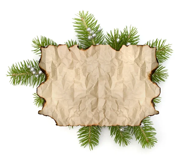 Old parchment paper with copy space on Christmas tree branch bac — Stock Photo, Image