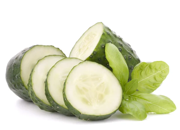 Sliced cucumber vegetable and basil leaves still life — Stock Photo, Image