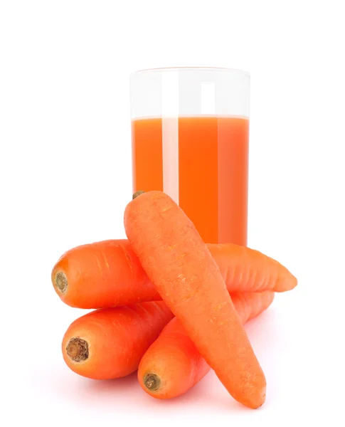 Carrot juice glass and carrot tubers — Stock Photo, Image