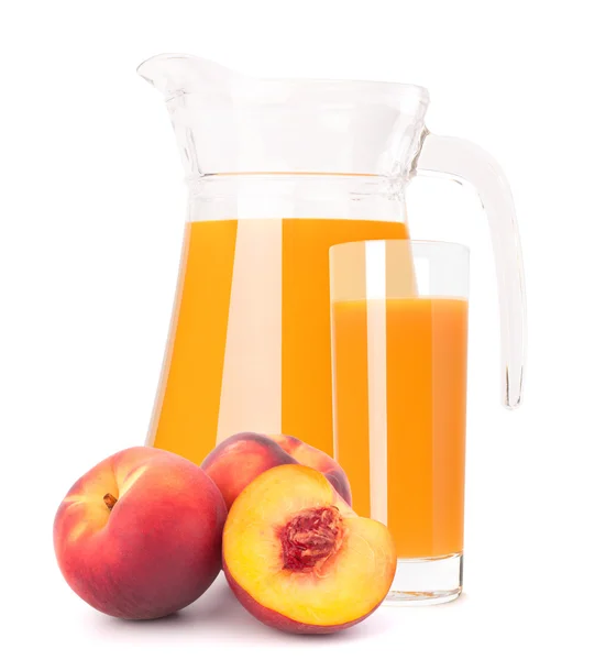 Peach fruit juice in glass jug — Stock Photo, Image