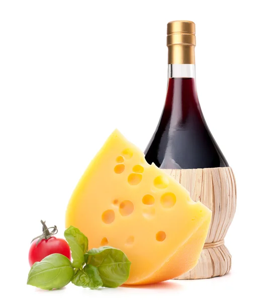 Red wine bottle, cheese and tomato still life — Stock Photo, Image